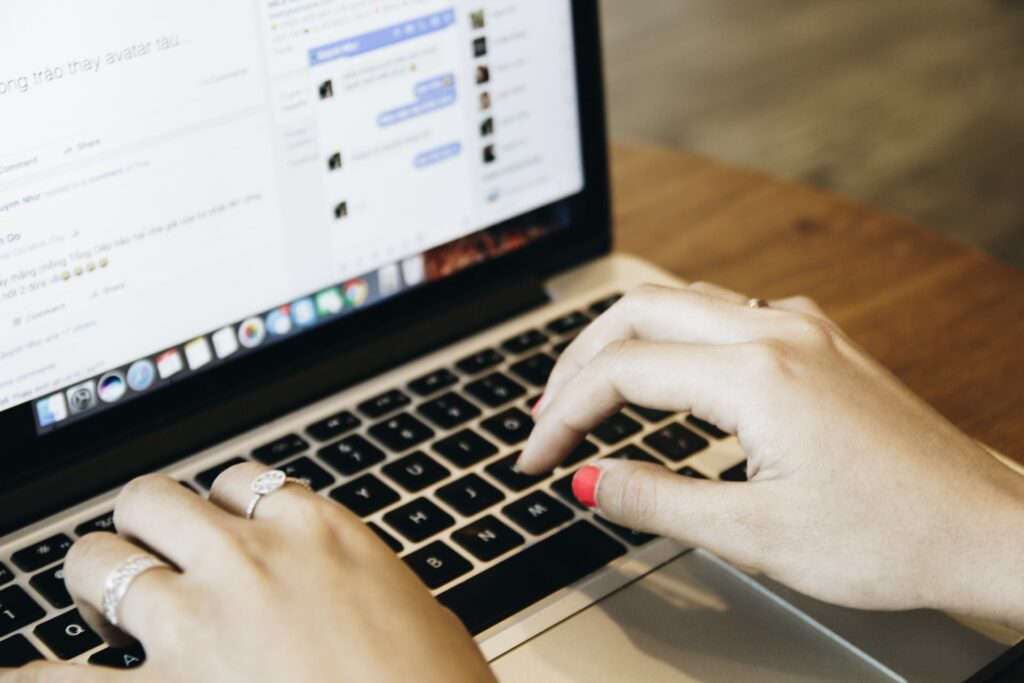 Woman typing on her laptop