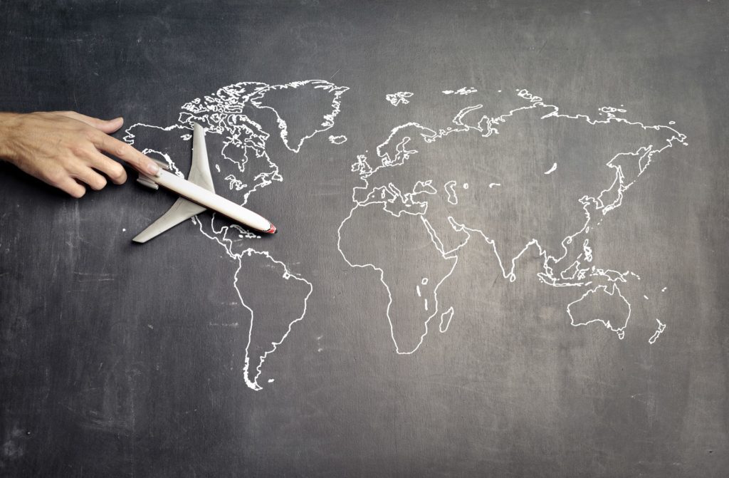 A world map drawn on a black board