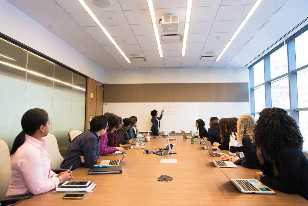 A lady training a team of colleagues