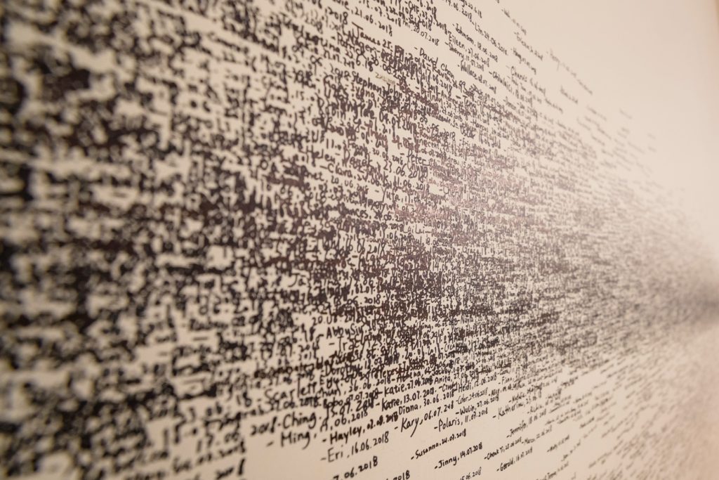 Thousands of words in black text against a white backdrop