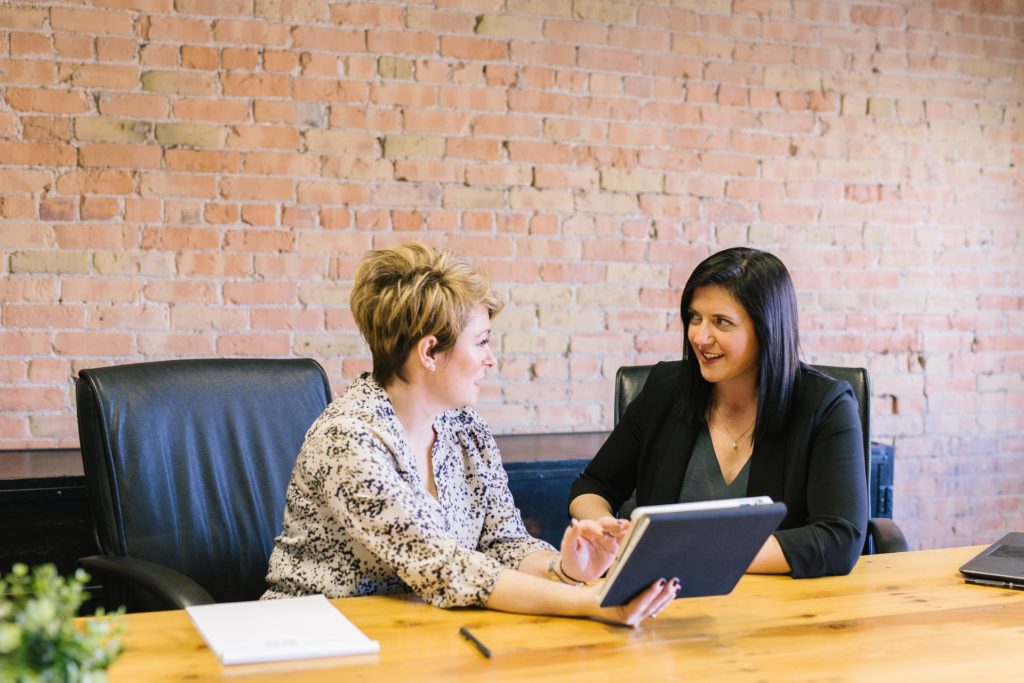 Two ladies engaging in software training