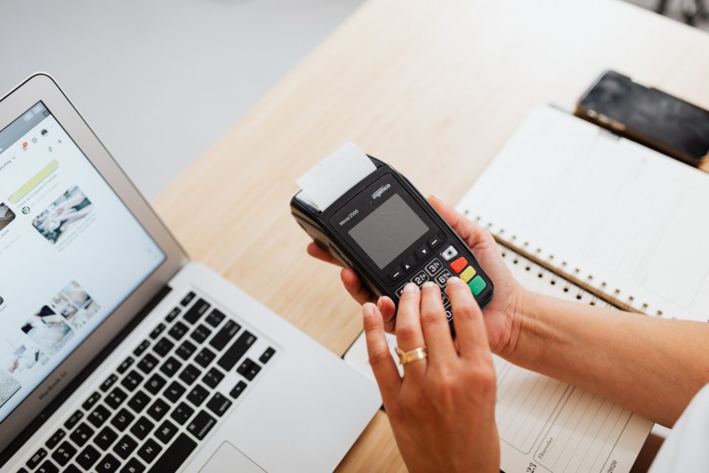 Person Holding Black Digital Device