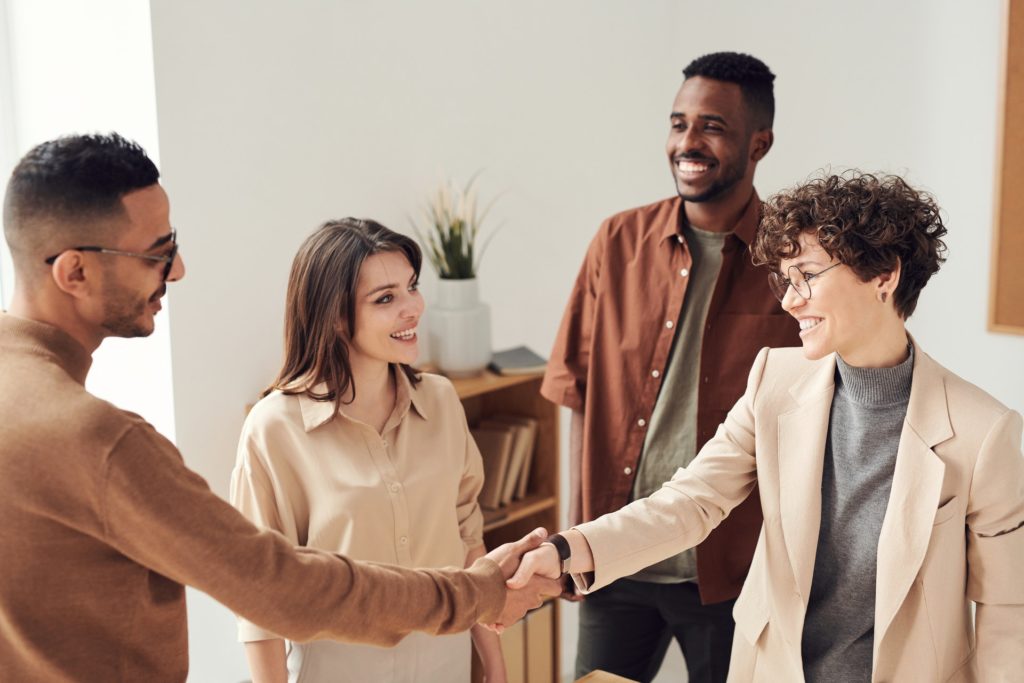 A female controller shaking hands with the accounting team