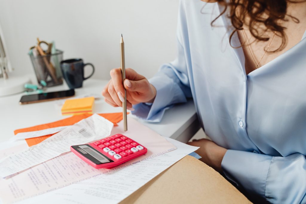 a female accountant capturing data on receipts