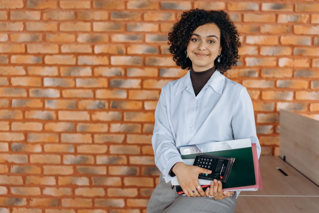 An accounting lady in a white button up shirt