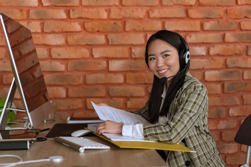 A smiling female accountant at her desk