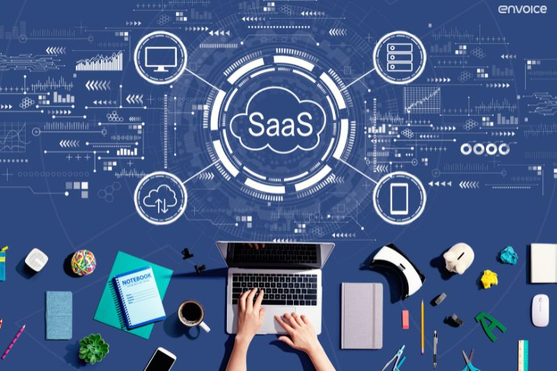 Hands on laptop with SaaS network icons, representing cloud-based AP automation technology.