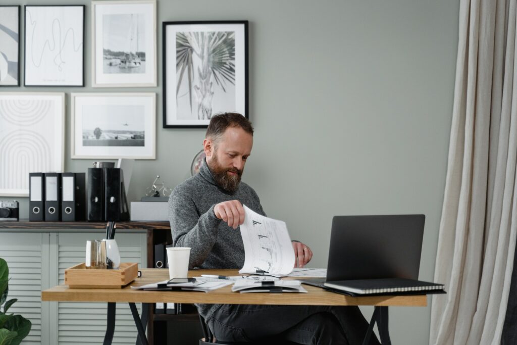 a man thinking at his desk about how to automate accounts payable