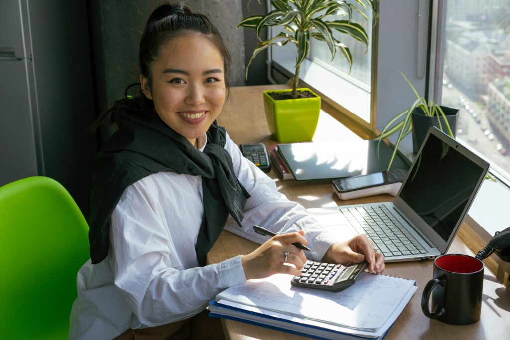 A smiling accountant working on AP