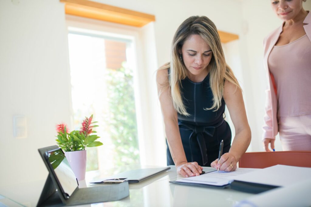 woman signing document