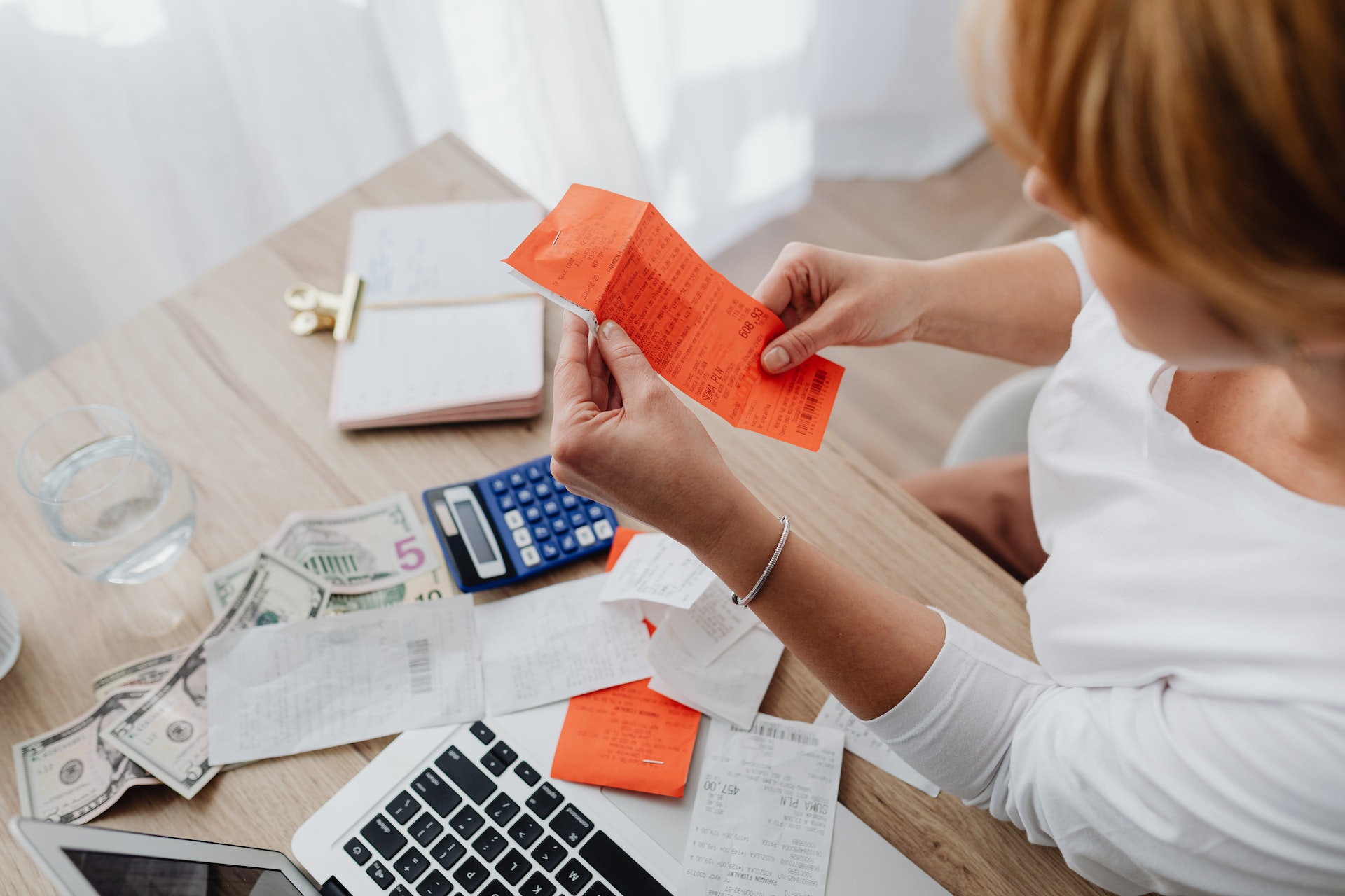 woman sorting receipts at work