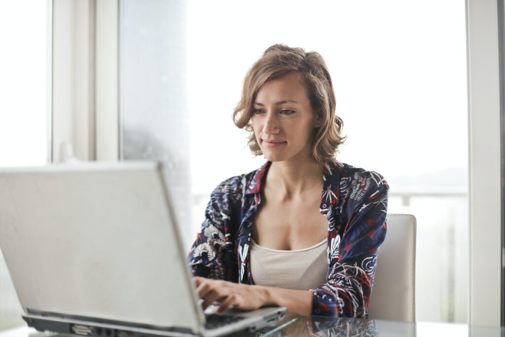 woman looking at laptop screen