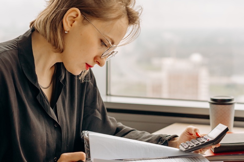 CPA holding a calculator