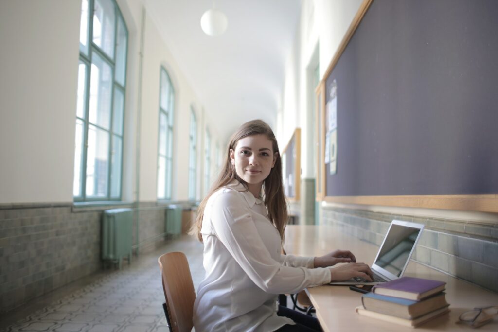 Female accounting student typing on a laptop