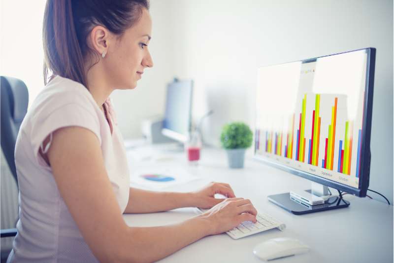 woman looking at her computer at work