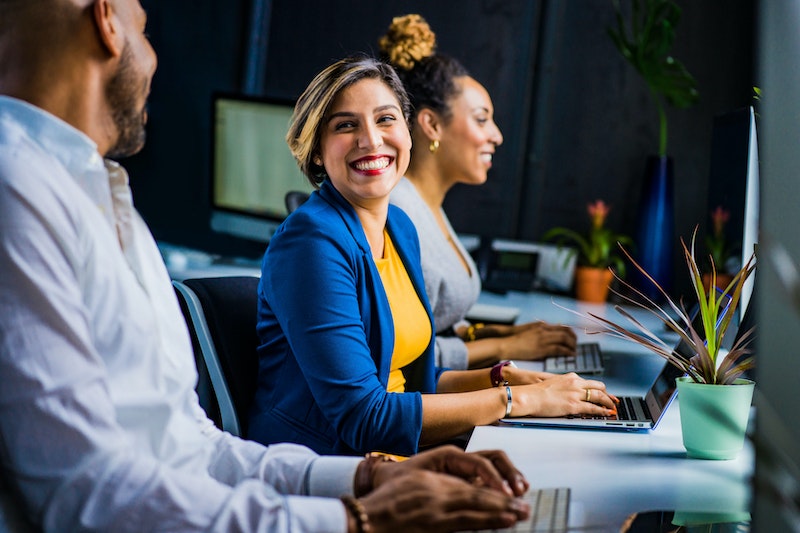 business woman smiling in her workplace