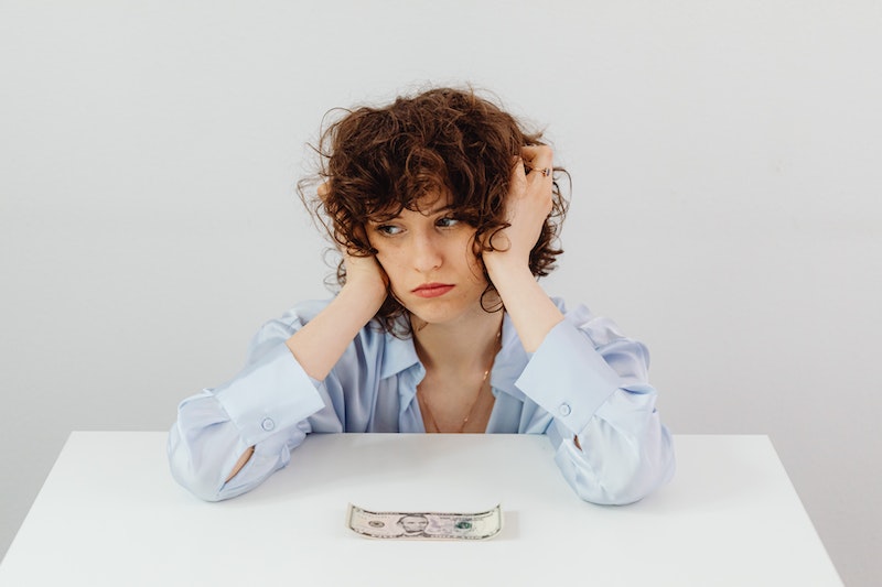 woman near a money on a table