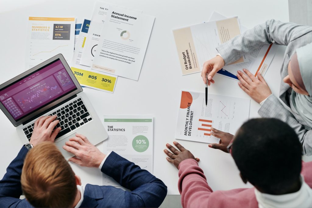 people-in-the-meeting-looking-at-financial records