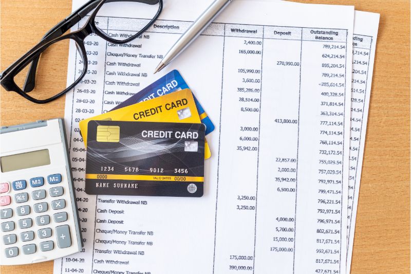 credit cards and calculator in the desk