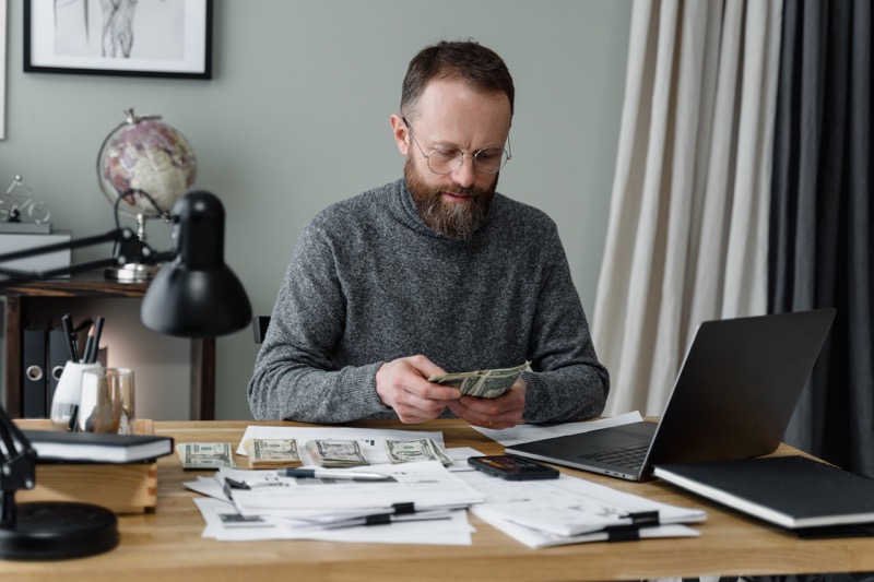 man counting money