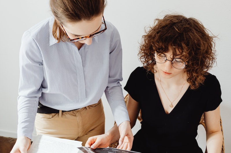 Two Women Doing Their Paperwork 