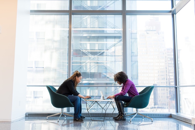 two workers sitting face to face