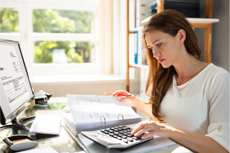 woman comparing documents at work