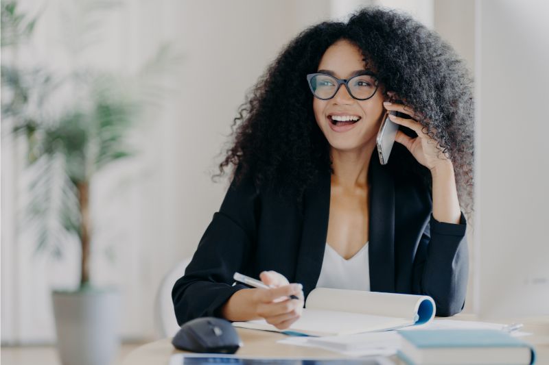 woman smiling on a phone call